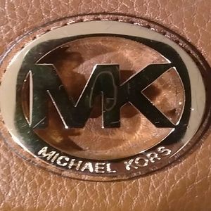 Michael Kors Brown leather wallet.